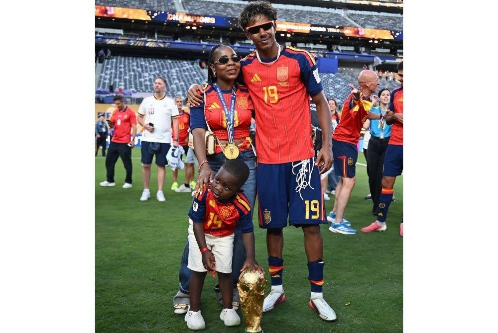 Lamine celebrates with his mother, Sheila Ebana, and younger half-brother, Keyne, after Spain's triumph.