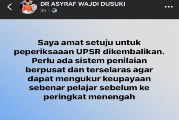 Tangkap layar status dimuat naik Asyraf Wajdi mengenai sistem peperiksaan pelajar.