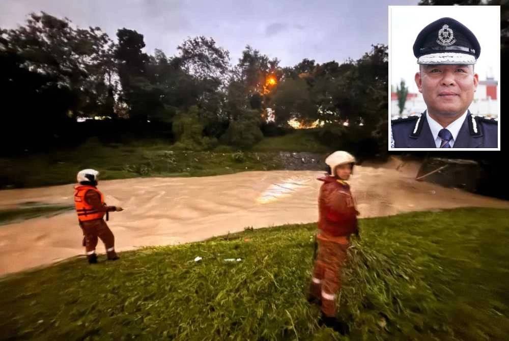 Operasi SAR mencari dua mangsa yang disyaki hanyut di Taman Prima Saujana di sini pada Khamis. - Gambar kecil (Naazron)