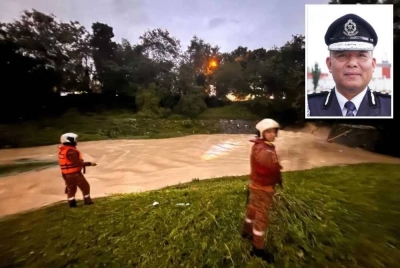 Operasi SAR mencari dua mangsa yang disyaki hanyut di Taman Prima Saujana di sini pada Khamis. - Gambar kecil (Naazron)