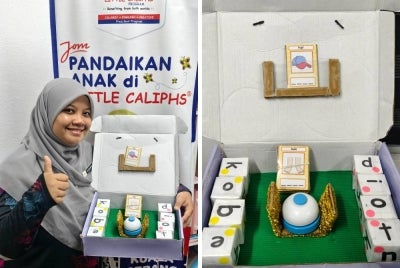 Teacher Diba bersama Smart Bell KVKV yang dibangunkan khusus untuk membantu murid menguasai kemahiran membina dan membaca perkataan KVKV melalui pendekatan pembelajaran yang menyeronokkan, interaktif dan berpusatkan murid.