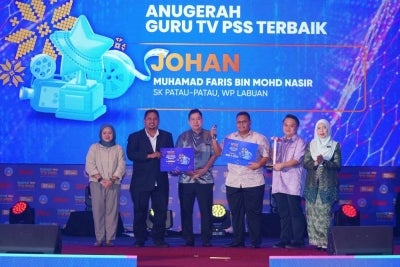 Muhamad Faris dinobatkan sebagai Johan kategori Guru TV PSS Terbaik. FOTO: MOHD HALIM ABDUL WAHID