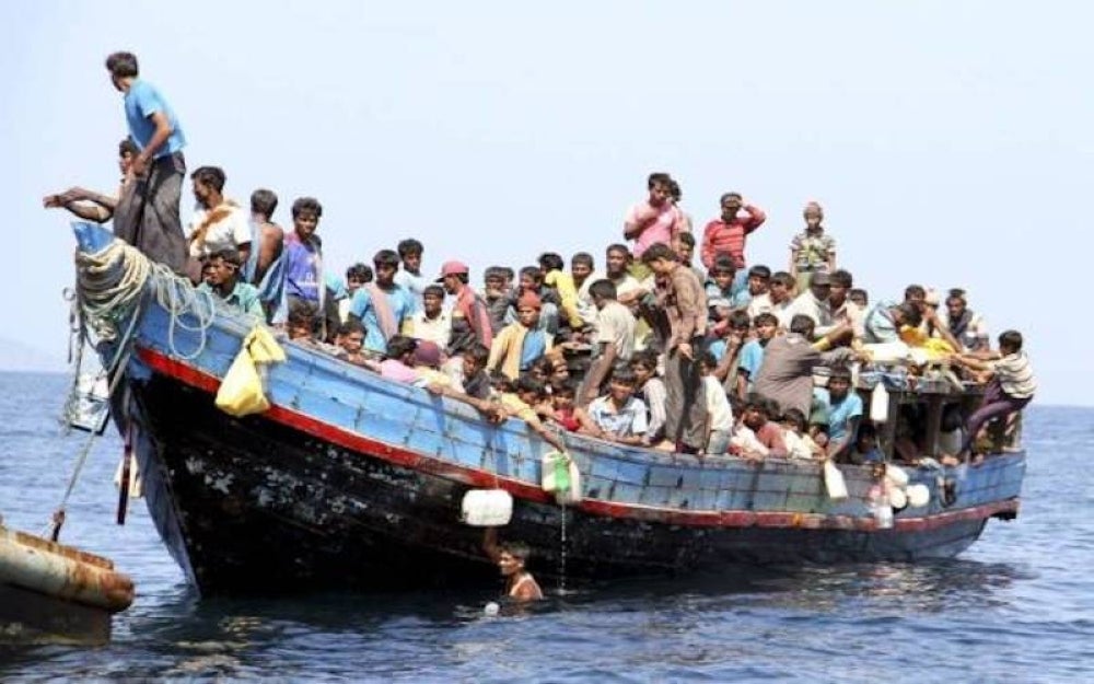 Boat packed with dozens of Rohingya refugees seen along the Indonesian coastline