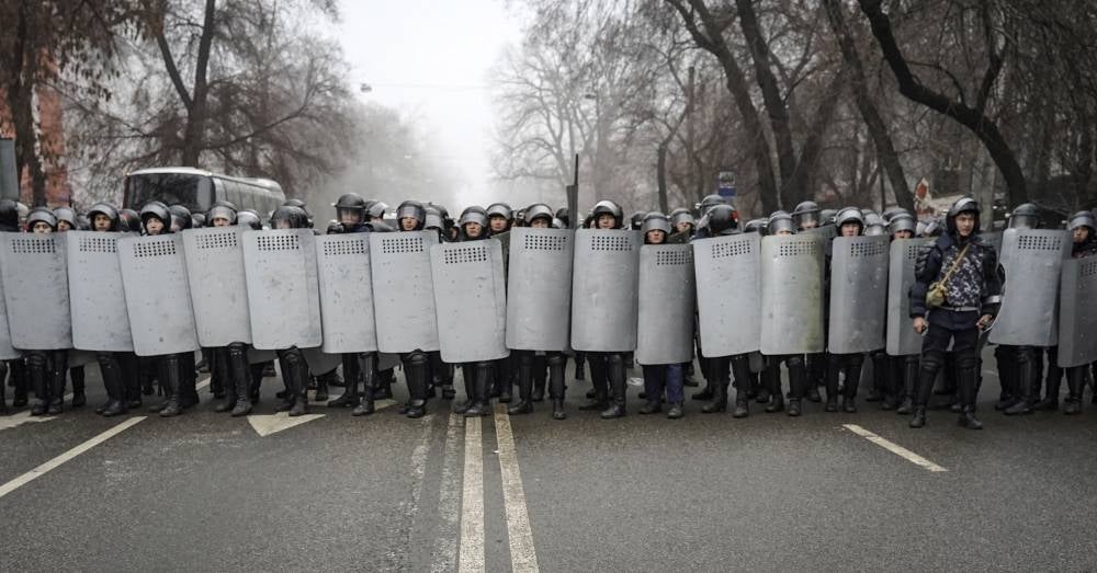 Riot police officers patrol in a street during a rally over a hike in energy prices in Almaty, Kazakhstan. Protesters have also stormed the mayor's office in Almaty, as Kazakh President Kassym-Jomart Tokayev declared a state of emergency in the capital until January 19, 2022. -- EPA/STR Photo 