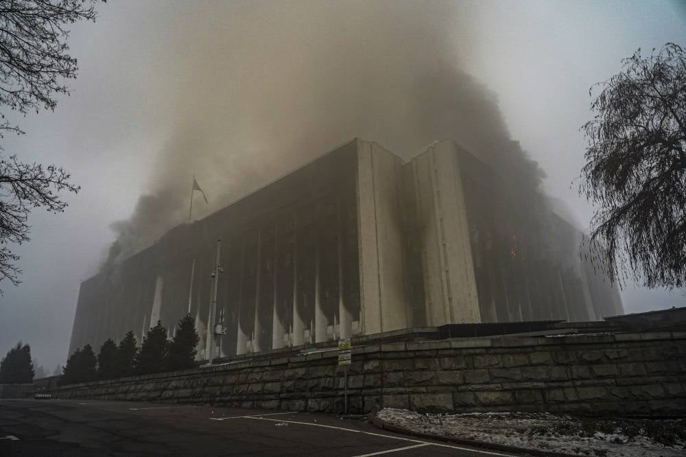 Almaty City Administration building burns during the protests over a hike in energy prices in Almaty, Kazakhstan, 06 January 2022 (issued 09 January 2022). Protesters stormed the mayor's office in Almaty, as Kazakh President Kassym-Jomart Tokayev declared a state of emergency in the capital until Jan 19, 2022. 164 people where killed during the riots as reported by Health Ministry, while 2,265 people in different regions of the country applied for medical assistance. (Source: EPA/STRINGER)