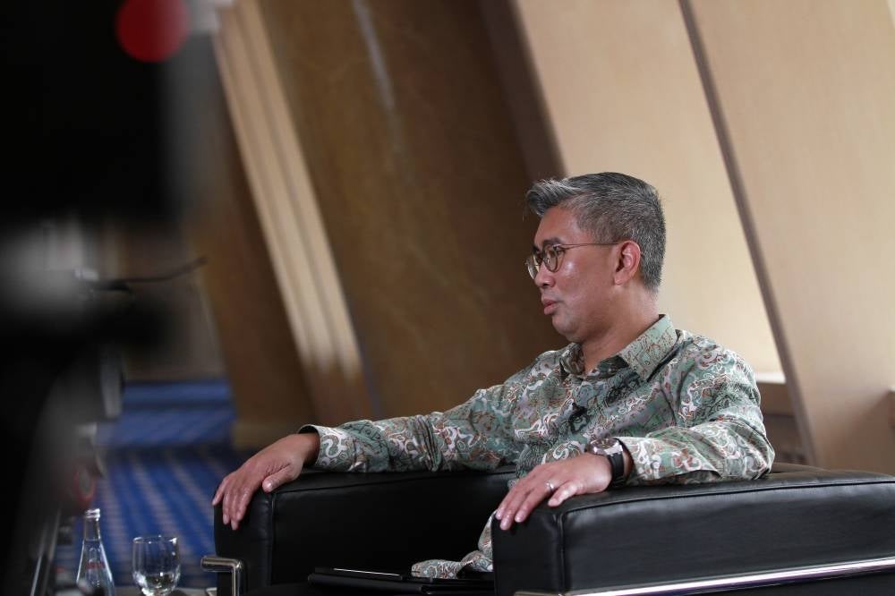 Tengku Zafrul dismisses claims that he wishes to contest in GE15, says he is more focused on his role as finance minister. - Photo by Muhammad Hafiz Adnan.