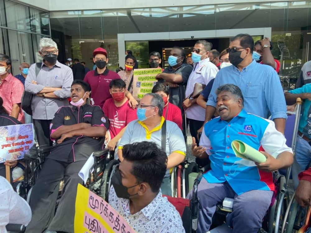Some members of the disabled communities that were present at the protest in Putrajaya today. They are calling for the Women ministry to do away with JKM Pay. - Photo courtesy of G. Francis Siva