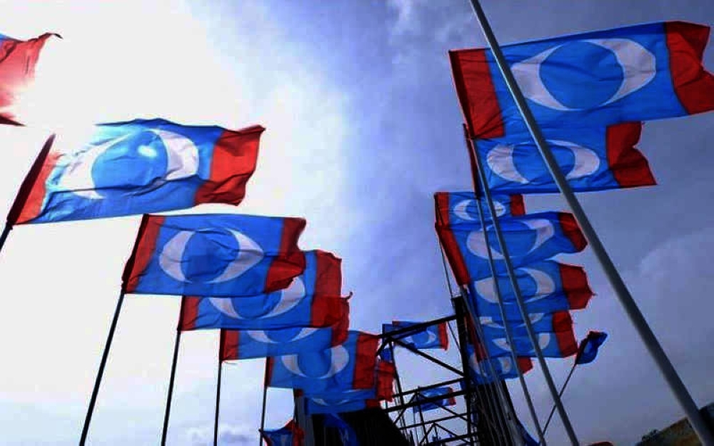 PKR communications director Fahmi Fadzil and Amanah's Information Chief Khalid Samad both dismissed claims cracks were forming in PH as the different logos are used for the Johor state election. - Photo by Bernama.