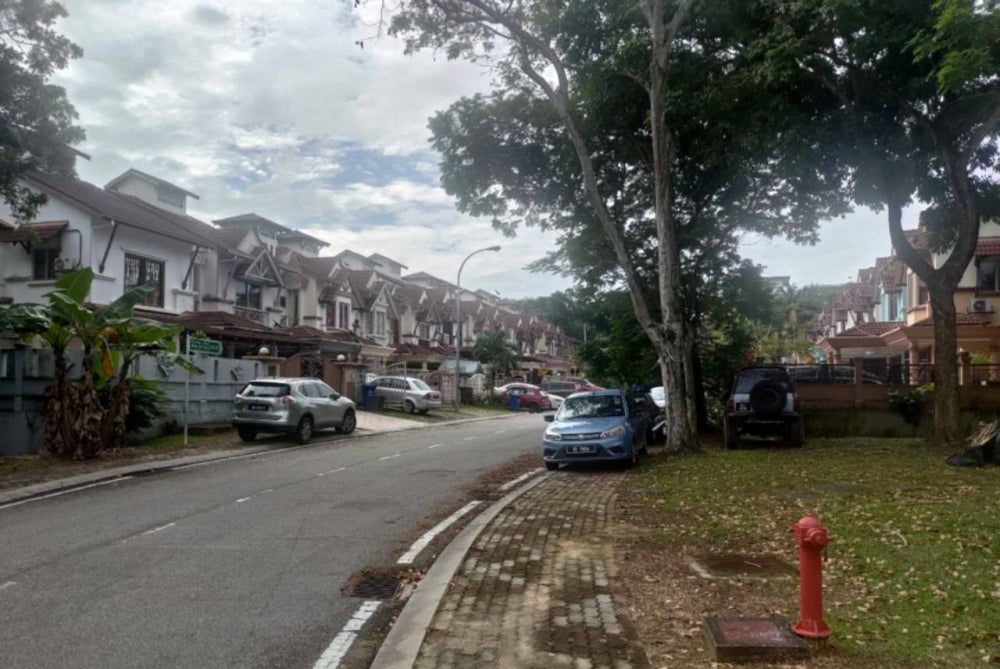 A row of homes located in between Dewan Pudina and a public play park. Some residents here have voiced their concerns over the hall being turned into a PKRC but ultimately understand the action by the government to do so. - Photo by Danial Dzulkifly