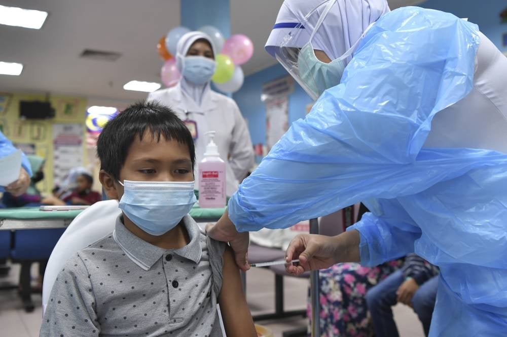 A boy getting his Covid-19 vaccine during the National Covid-19 Immunisation Programme for Kids (PICKids) at the Sultanah Nur Zahirah Hospital (HSNZ), in Terengganu on Feb 8, 2022. -BERNAMA
