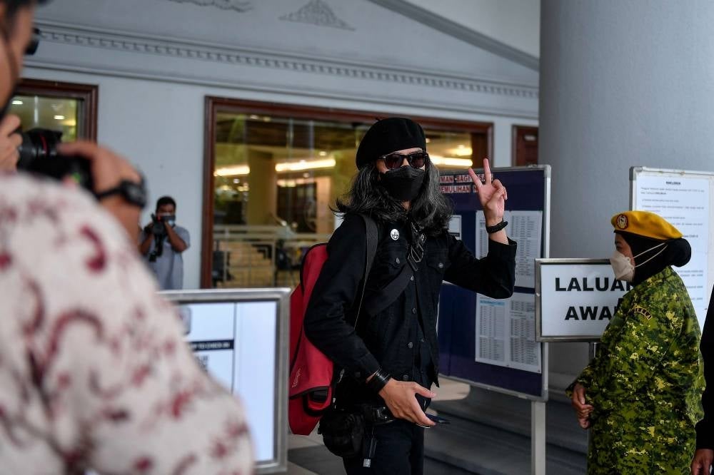 Graphic designer Fahmi Reza was charged at the KL Sessions Court with posting an offensive content on his Twitter account relating to quarantine rules on a minister returning from overseas in February, 2021. - BERNAMA