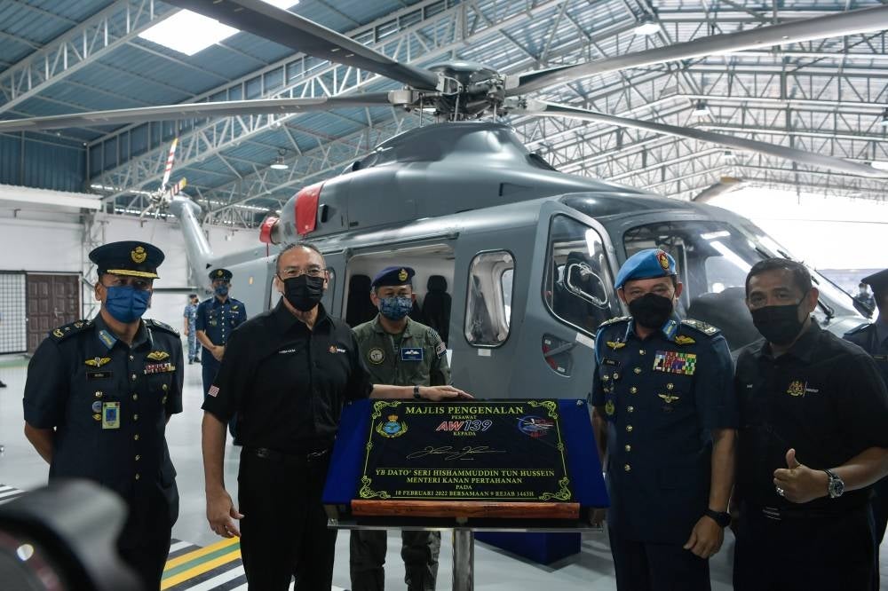 Senior Defence Minister Datuk Seri Hishammuddin Hussein (two from left) with Royal Malaysian Air Force (RMAF) chief Gen Tan Sri Ackbal Abdul Samad (two from right) at the RMAF AW 139 Helicopter Introduction Programme. - BERNAMA