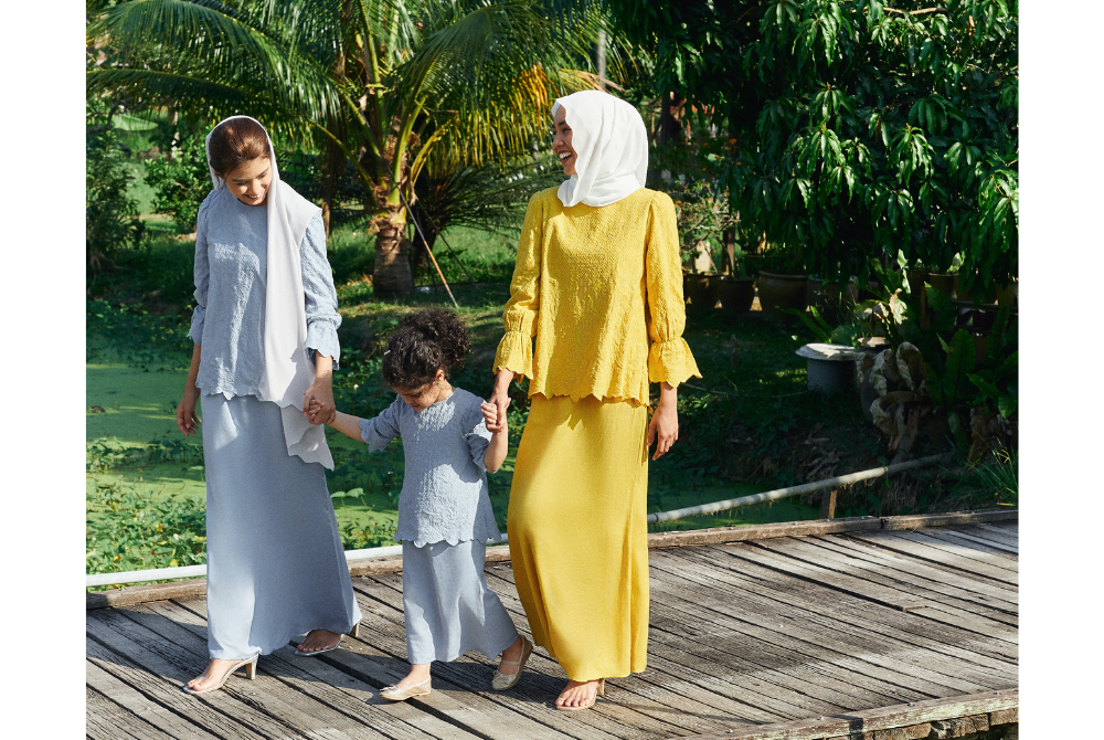 From left, Widuri blouse and skirt combo in blue bell and mustard. Prices range from RM209 to RM329.