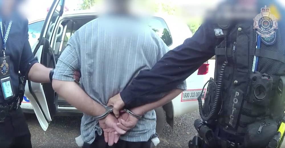 A still image taken from a handout video made available by the Queensland Police Service (QPS) shows Queensland police arresting Graham Gene Potter. - EPA