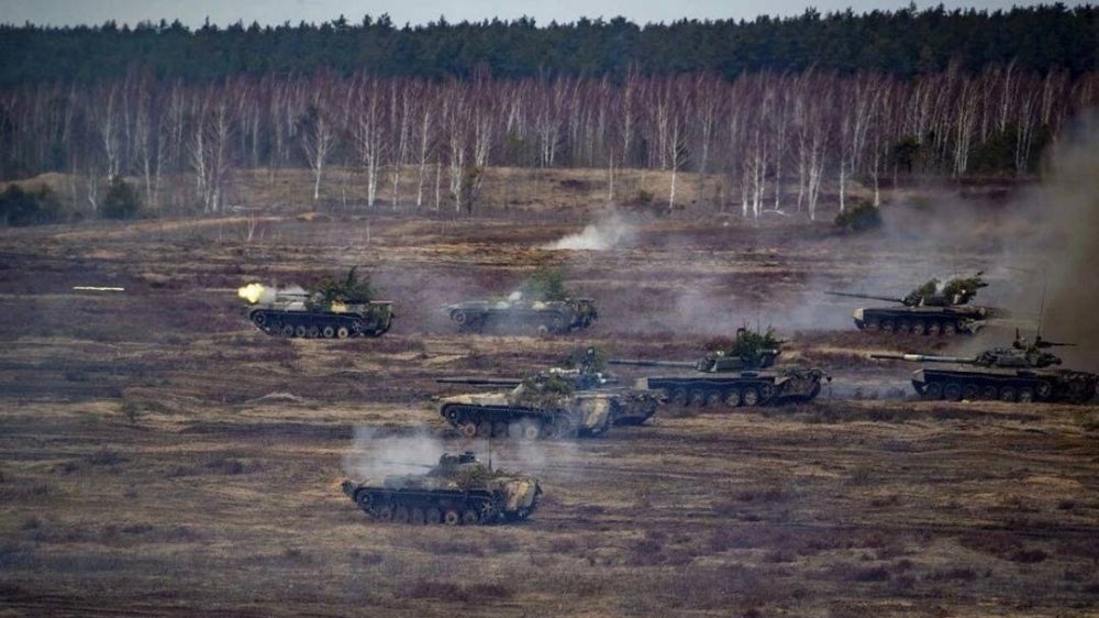This handout photo from the Russian Defence Ministry on Feb 21, 2022, shows Russian and Belarus tanks during joint exercises of their armed forces near Brest, Belarus - AFP