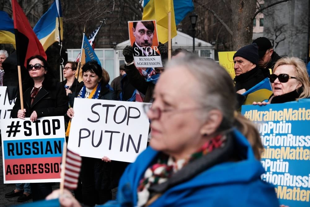 Dozens of pro-Ukrainian activists and Ukrainian Americans rally outside of the United Nations (UN) as world leaders gather there to discuss the increasing tension with Russia over its military build-up on Ukraine's border on Feb 17, 2022 in New York City. -AFP