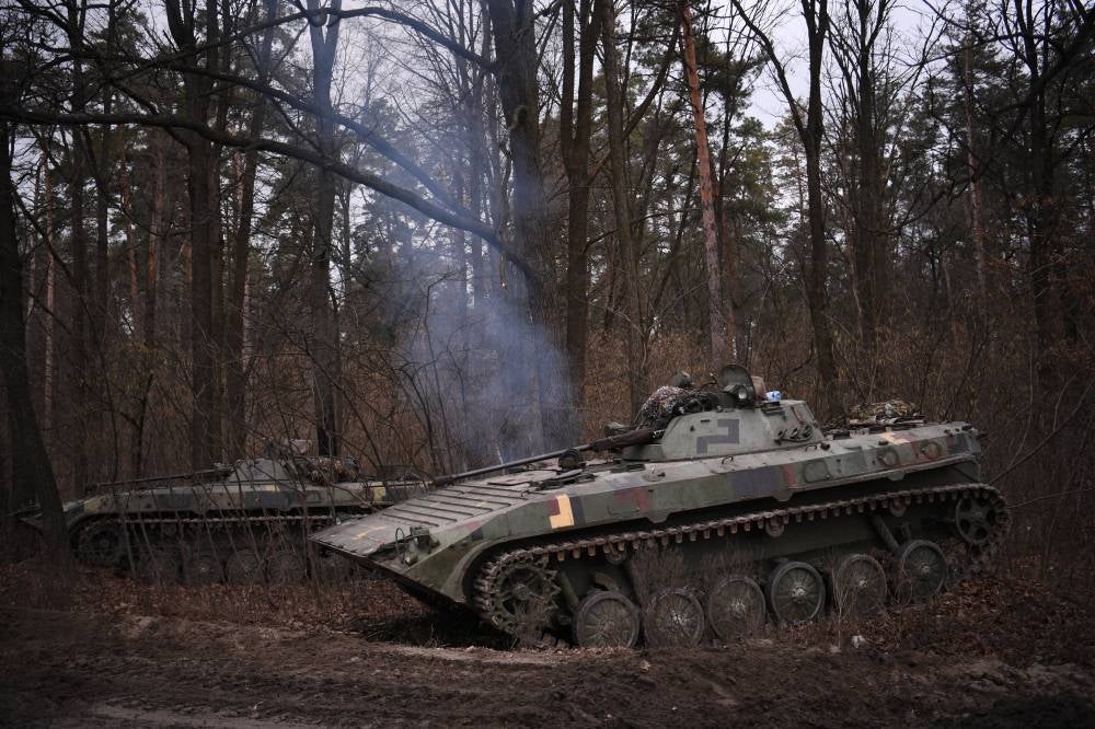 This photograph taken on Feb 24, 2022, shows a Ukrainian infantry combat vehicle BMP-2 standing guard on the outskirts of Kyiv. - AFP