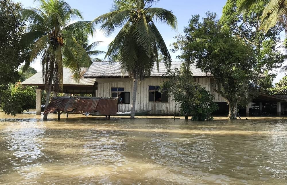 Floodwaters rise inside a house in Tumpat. - BERNAMA