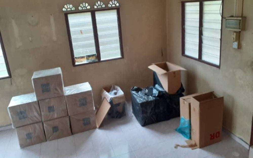 Some of the boxes containing contraband cigarettes seized by the police.