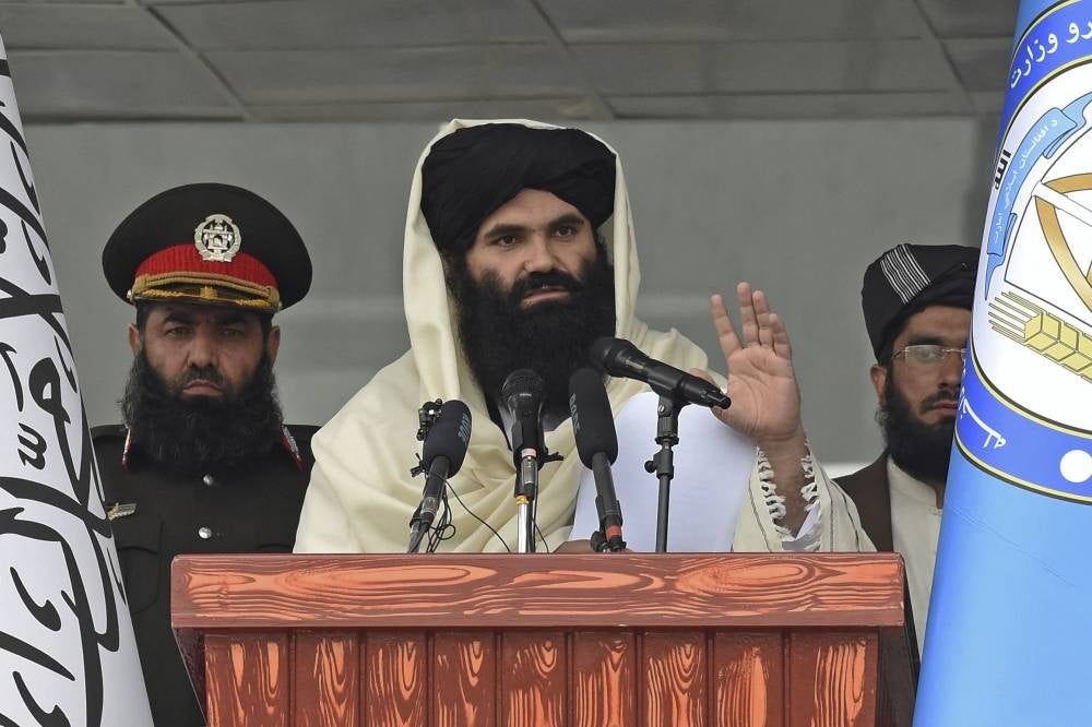 Taliban Interior Minister Sirajuddin Haqqani speaks to new Afghan police recruits during a graduation ceremony at the police academy in Kabul on March 5, 2022. - AFP