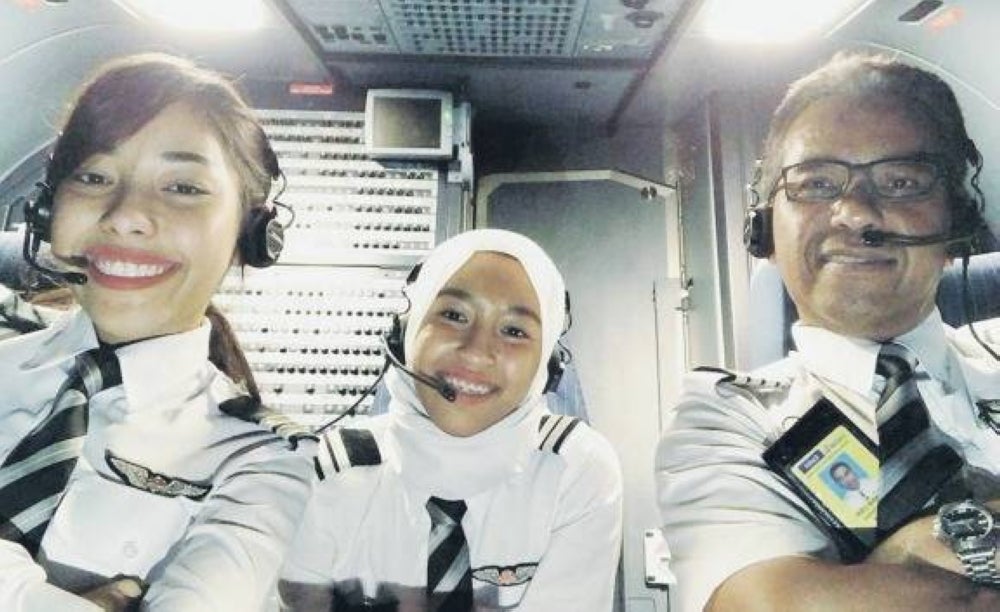 Senior Pilot of AirAsia, Safia Amira and her sister Safia Anisa with their father Captain Abu Bakar