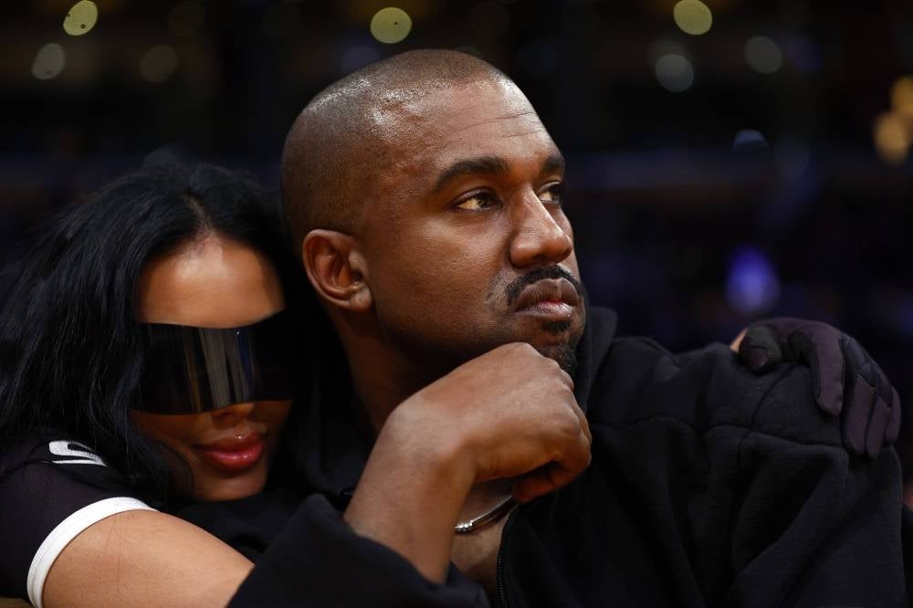Rapper Kanye West and girlfriend Chaney Jones attend a game between the Washington Wizards and the Los Angeles Lakers in the fourth quarter at Crypto.com Arena on March 11, 2022 in Los Angeles, California. - AFP Photo