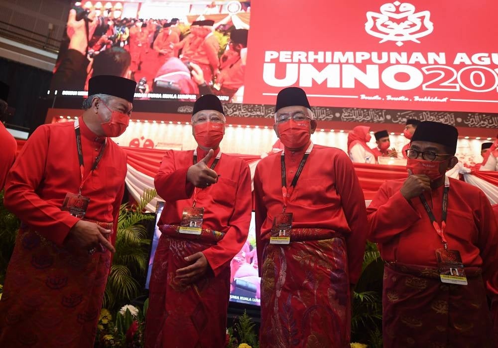 Umno president Ahmad Zahid Hamidi (left) along with the Prime Minister Ismail Sabri Yaakob who is also Umno's vice president (two from left) and other Umno leaders at the party annual general assembly at the World Trade Centre. - Bernama Photo