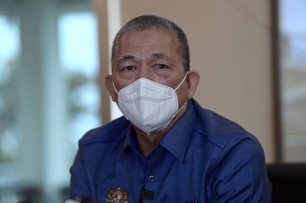  Senior Works Minister Datuk Seri Fadillah Yusof after inspecting the FT252 Jalan Gunung Jerai slope repair work, today. - BERNAMA