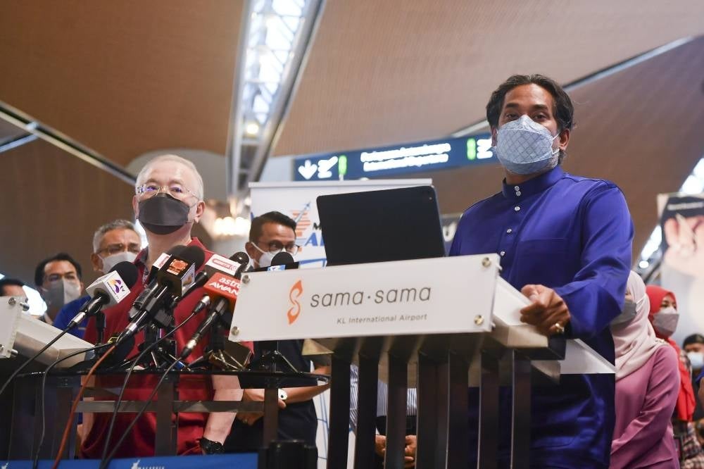 Health Minister Khairy Jamaluddin and Transport Minister Datuk Seri Dr Wee Ka Siong after inspecting the preparedness at the Kuala Lumpur International Airport (KLIA) in conjunction with the reopening of the country's borders. - BERNAMA