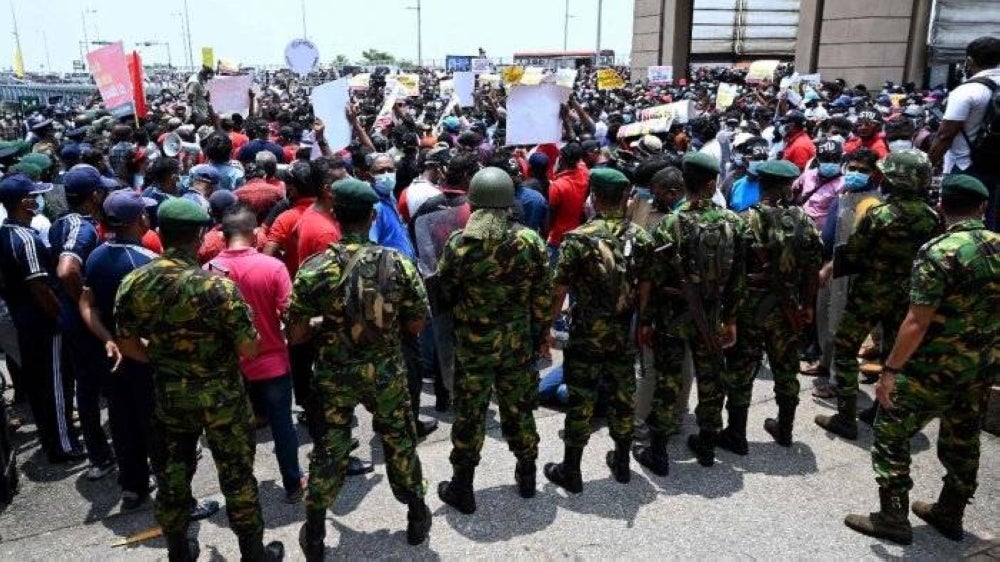 Authorities say troops were deployed after angry crowds blocked a busy street in Colombo and delayed the traffic operation for hours, preventing people from buying gas. - AFP pic