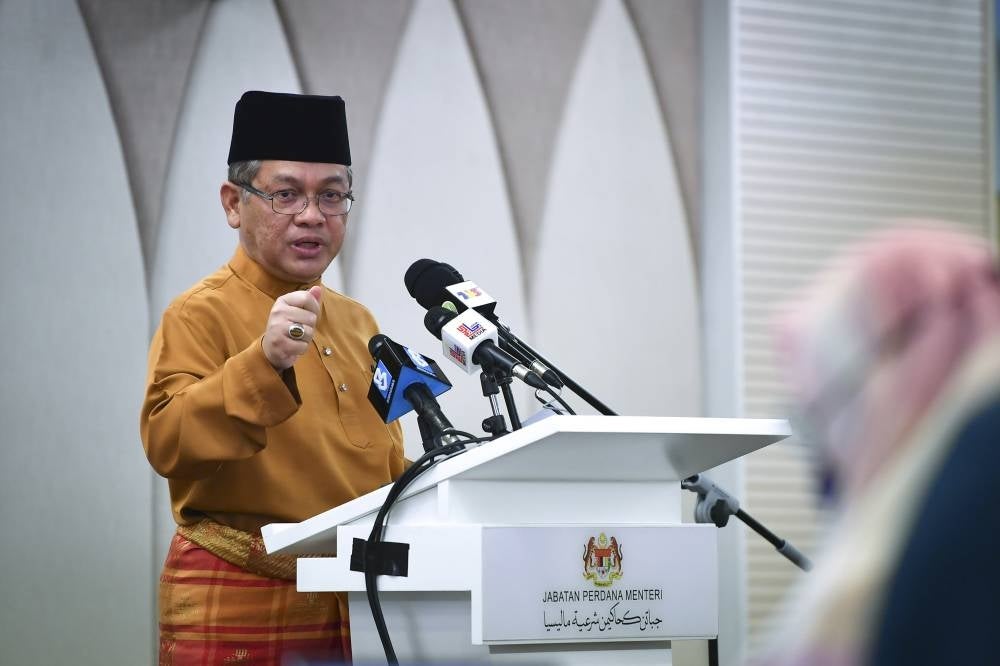 Chief Syarie Judge Datuk Dr Mohd Na’im Mokhtar during a press conference over alimony issue, today. - BERNAMA