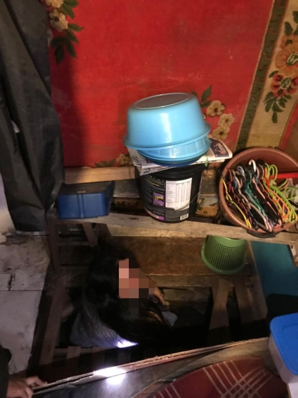 An illegal immigrant attempted to escape using a secret underground passage during the raiding operation by the Kuala Lumpur Immigration Department, in Pantai Dalam on Sunday.