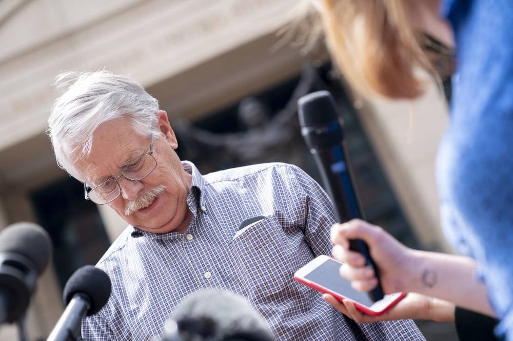 Carl Mueller, the father of American human rights activist Kayla Mueller slain by IS militants, speaks to reporters outside the Albert V. Bryan Federal Courthouse following the trial of IS member El Shafee Elsheikh, the “Beatle”, in Alexandria, Virginia, on April 14, 2022. - AFP