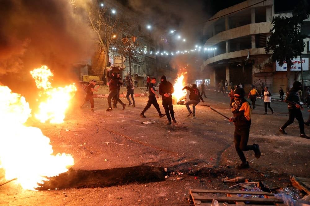 Palestinian protesters clashes with Israeli forces in the West Bank city of Hebron, 16 April 2022. - EPA Photo