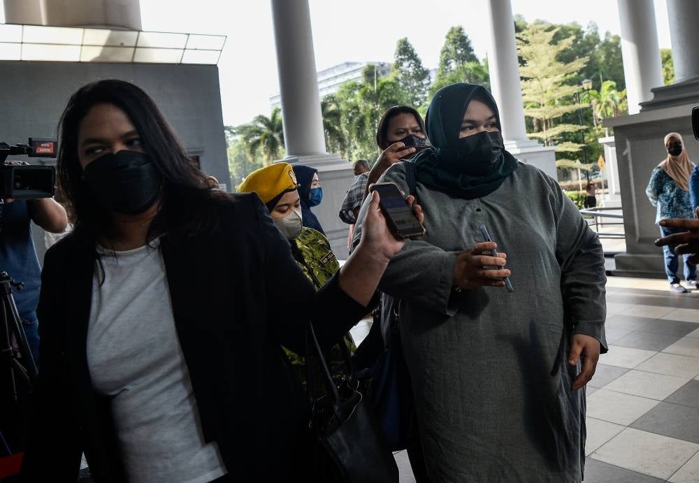 Rumah Bonda founder Siti Bainun Ahd Razali at the Kuala Lumpur Courts Complex for her trial on charges of neglecting and abusing down syndrome teenager Bella - BERNAMA