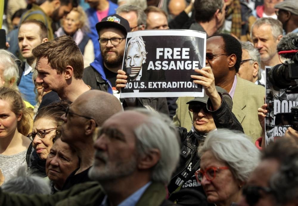 People take part in an EU Free Assange rally in Brussels, Belgium, 23 April 2022. The rally takes place at central Place de la Monnaie and is organized by the activist organization 'Free Assange Wave' campaigning to free the WikiLeaks founder who has been jailed in the UK and fighting extradition to the US. - EPA Photo