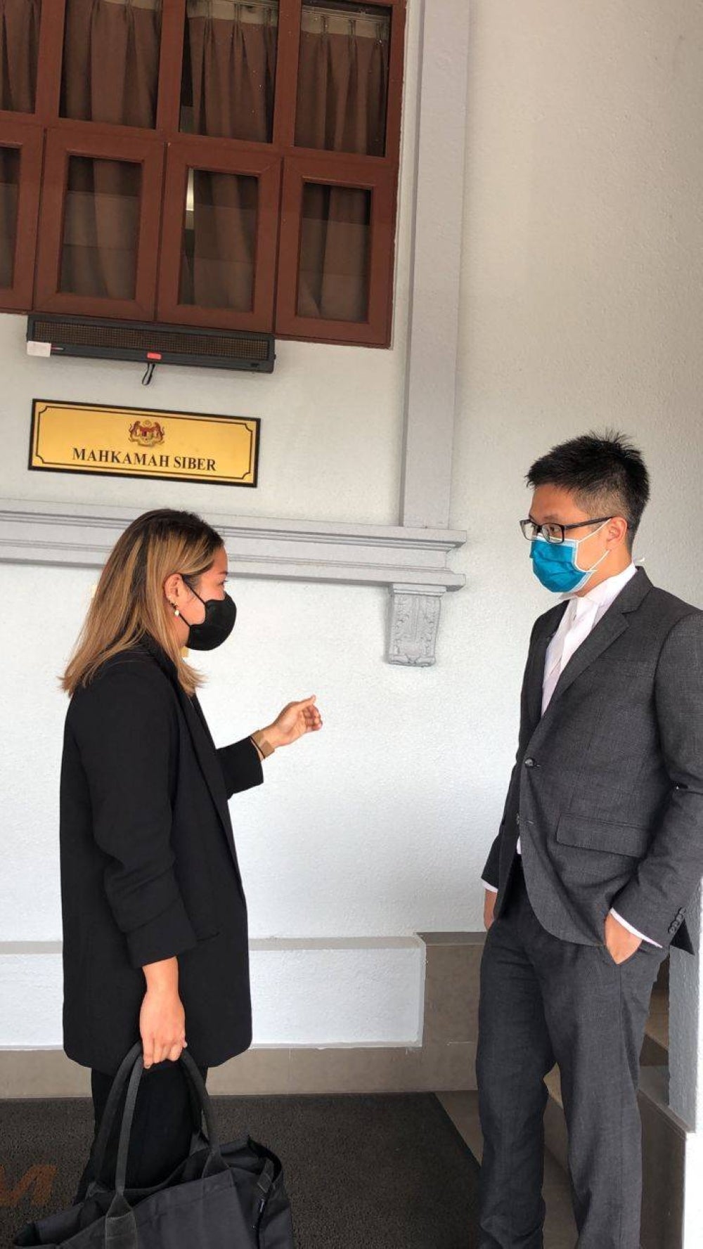 Heidy Quah (right) with her lawyer New Sin Yew (left) at the Kuala Lumpur Courts Complex today.