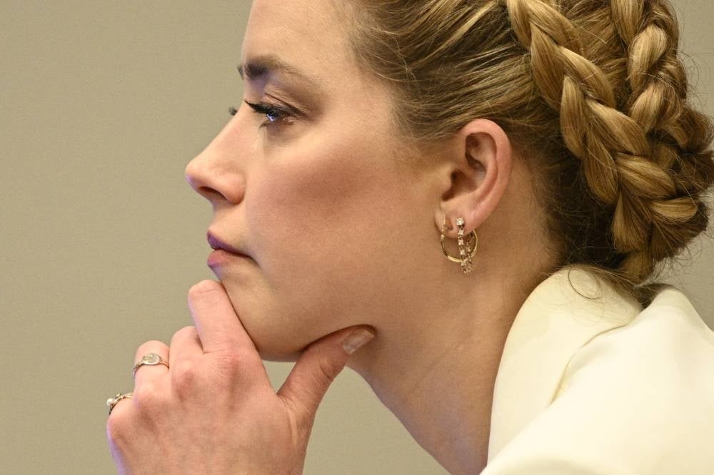 Actress Amber Heard listens in the courtroom at the Fairfax County Circuit Courthouse in Fairfax, Virginia, April 26, 2022. - AFP