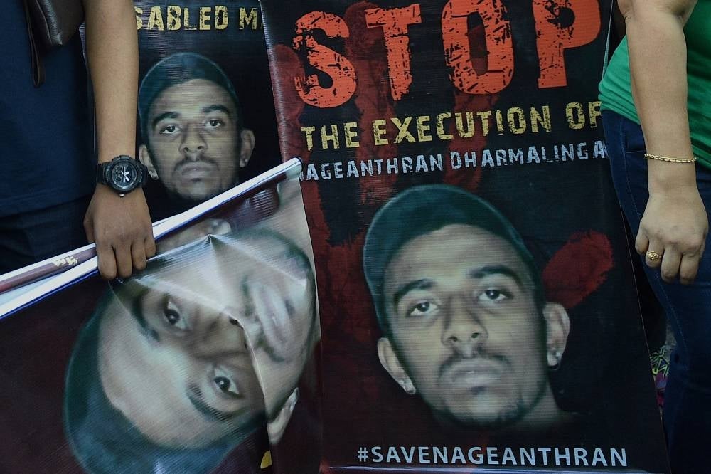 Activists protesting against the planned execution of Nagaenthran K. Dharmalingam, a mentally disabled Malaysian man sentenced to death for trafficking heroin into Singapore in 2009, outside the Singapore High Commission in Kuala Lumpur. - AFP