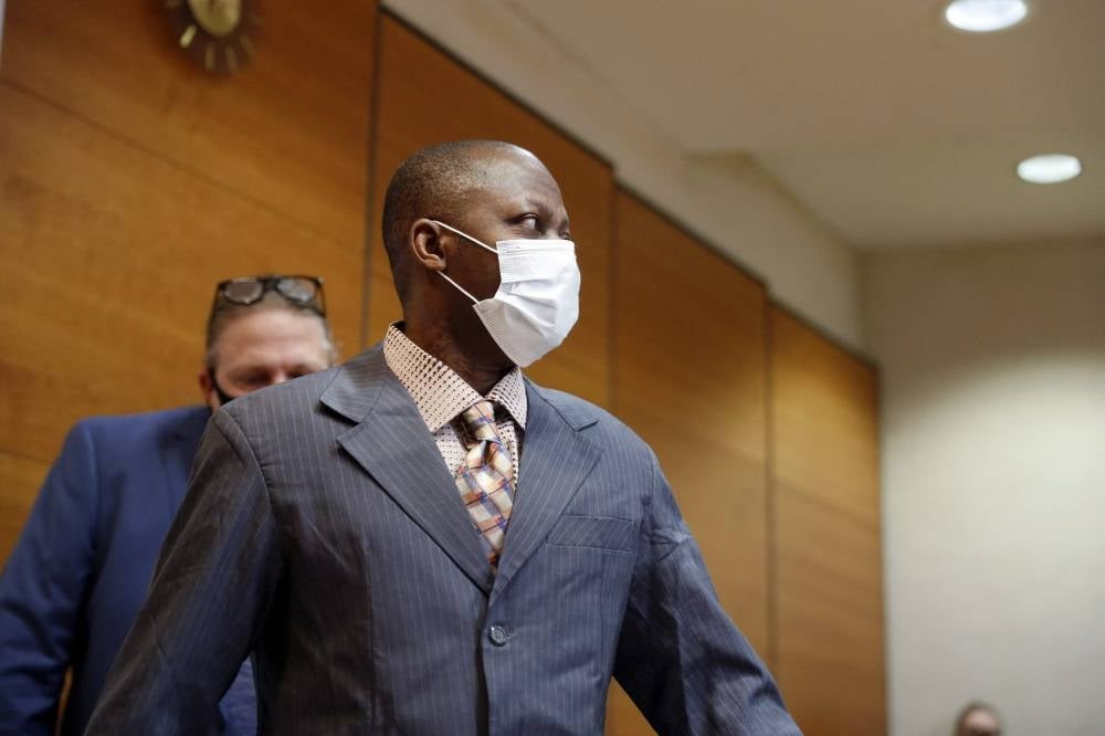 Sierra Leonean national Gibril Massaquoi enters the courtroom to attend the first day of his trial at the Pirkanmaa District Court in Tampere, Finland, on Feb 3, 2021. - AFP