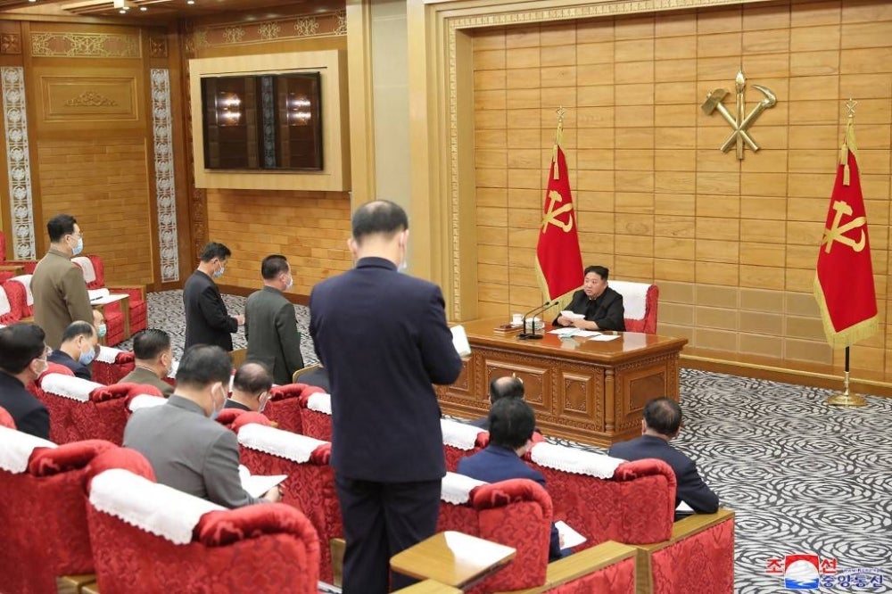 Korean Central News Agency (KCNA) photo taken on May 14, 2022 shows North Korean leader Kim Jong Un taking part in Workers' Party of Korea council to check the operational status of the maximum emergency measurement to prevent the spread of Covid-19 infection in Pyongyang. - AFP