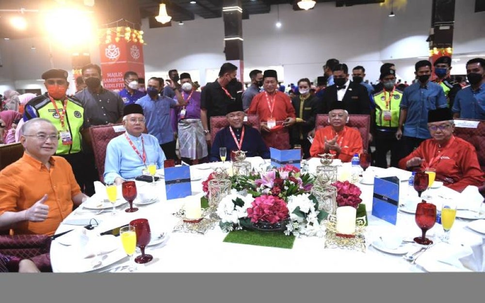 Umno President Datuk Seri Ahmad Zahid Hamidi (middle, sitting) with PM Datuk Seri Ismail Sabri Yaakob (2nd right, sitting) with former PM Datuk Seri Najib Tun Razak (2nd left, sitting) at PWTC. - Photo Bernama 