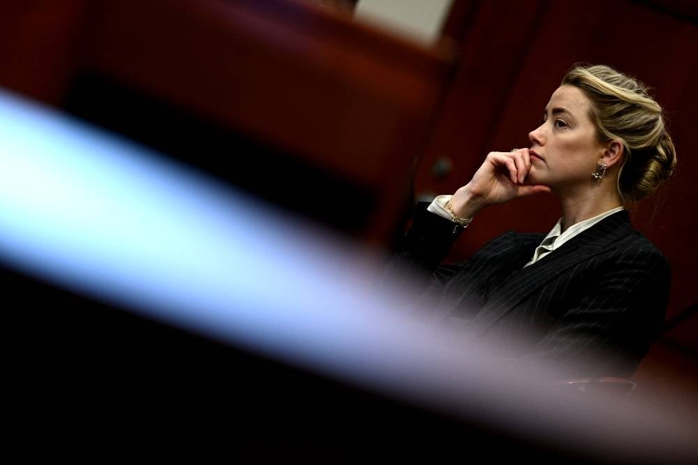 US actress Amber Heard looks on in the courtroom at the Fairfax County Circuit Courthouse in Fairfax, Virginia, on May 17, 2022. - AFP