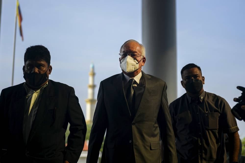 Datuk Seri Najib Razak (middle) at the Kuala Lumpur Courts Complex for his 1MDB trial. - BERNAMA