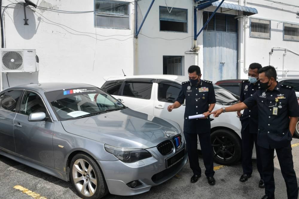 The police seized four vehicles including a Toyota Wish and a BMW as well as jewellery, all worth RM119,204.26.