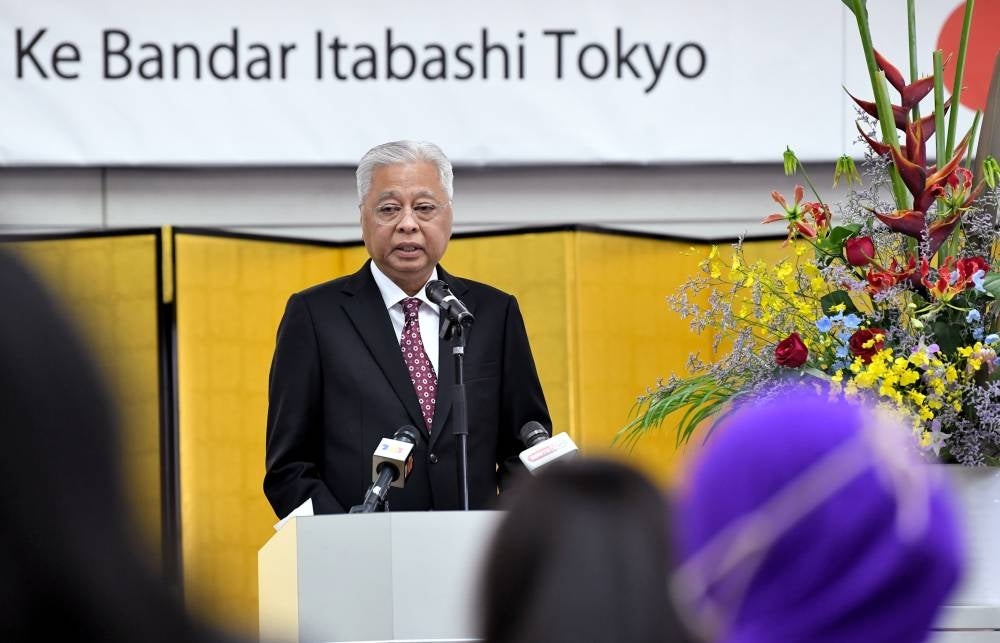 Prime Minister Datuk Seri Ismail Sabri Yaakob delivers his speech during the ceremony to celebrate his inaugural visit to Japan since holding the post of Malaysian Prime Minister at Itabashi City Hall, Tuesday. - BERNAMA