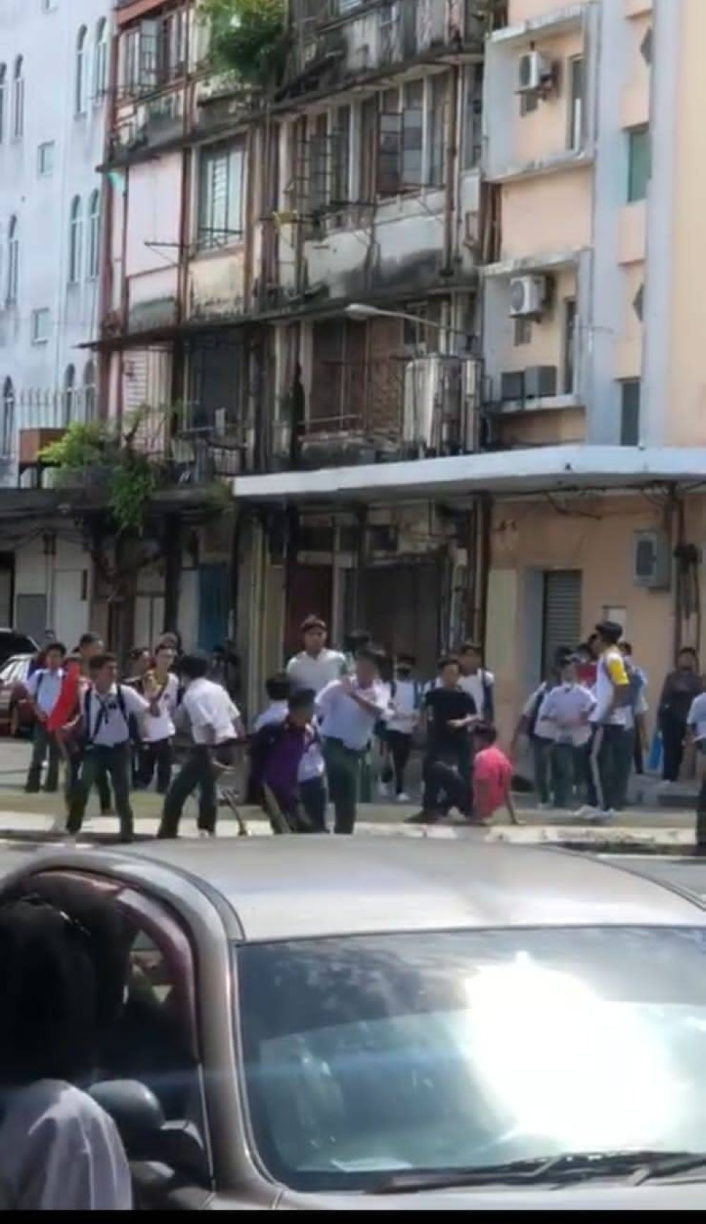 Series of photos of students fighting in Sandakan