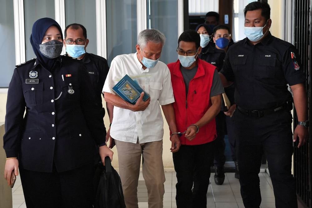 Former diplomat Datuk Zainal Abidin Alias, 78, and his son Mohamed Rizal, 53, were charged at the Raub Sessions Court, today with planting 102 ganja (cannabis) trees at a house in Kampung Sum-Sum Hilir, Janda Baik, Bentong on May 21. - BERNAMA