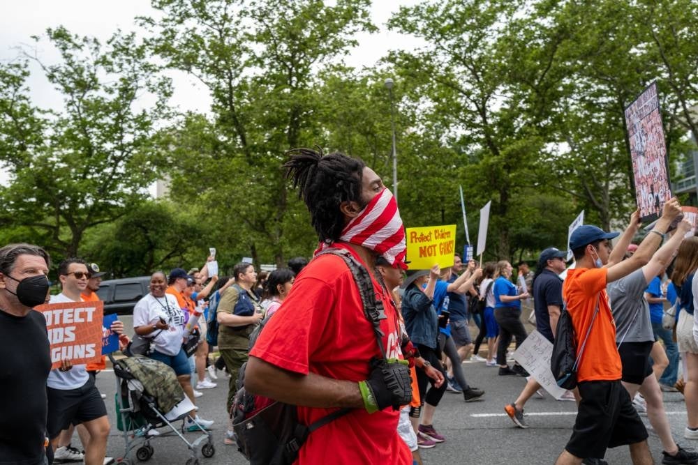 People march across the Brooklyn Bridge to protest against gun violence in the March for Our Lives march and rally on June 11, 2022 in New York City. - AFP