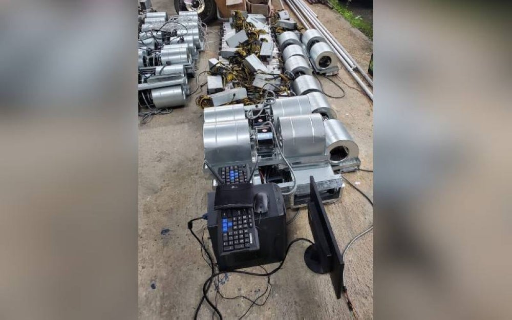 Among the Bitcoin machines seized in the raid at Taman Putra Prima on Monday. Photo: SINAR HARIAN